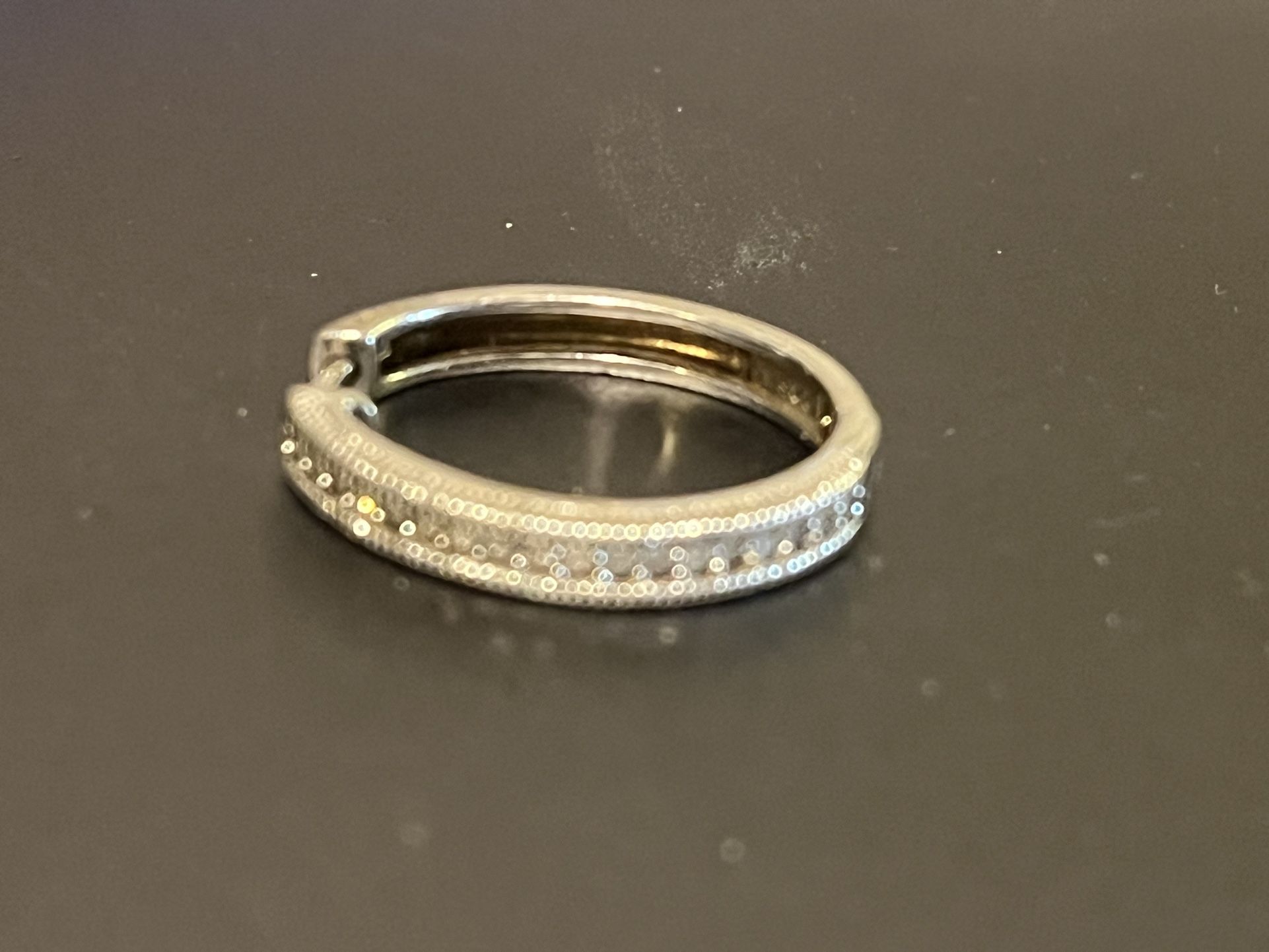 One Silver Earring With Diamonds