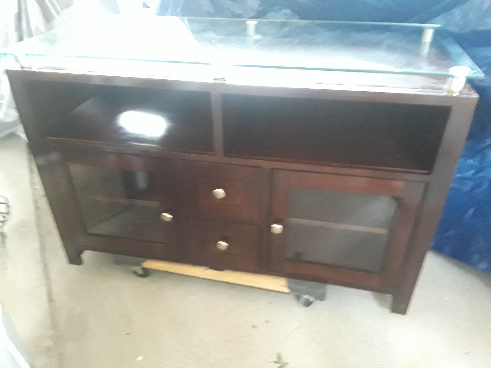 Heavy 47 inch glass top with dark wood tv stand with drawers and doors