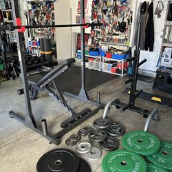 Weightlifting Equipment Squat Rack and Olympic bar . Bench   Olympic Weights with Weight Rack 280 Lbs. Not selling Separately must purchase All Togeth