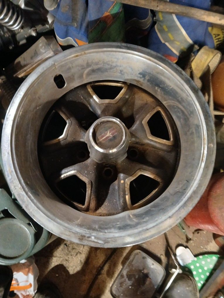 Fourteen inch oldsmobile rallies With center caps and two beauty rings