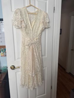 Cream colored lined lace dress