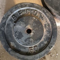 2 50lb plates & 1 25lb plate