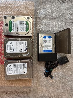 Lot of 4 3.5" Hard Drives with Docking Station