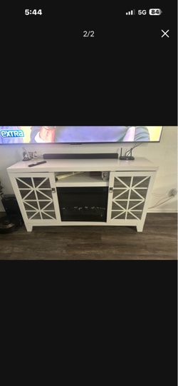 White TV stand electronic fireplace with the heater