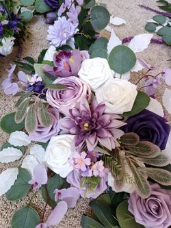 2 Artificial Flower Garland wreaths for table decor

Condition is used twice

Measurement of each arrangement left to right
Longest: 134 Inches long a