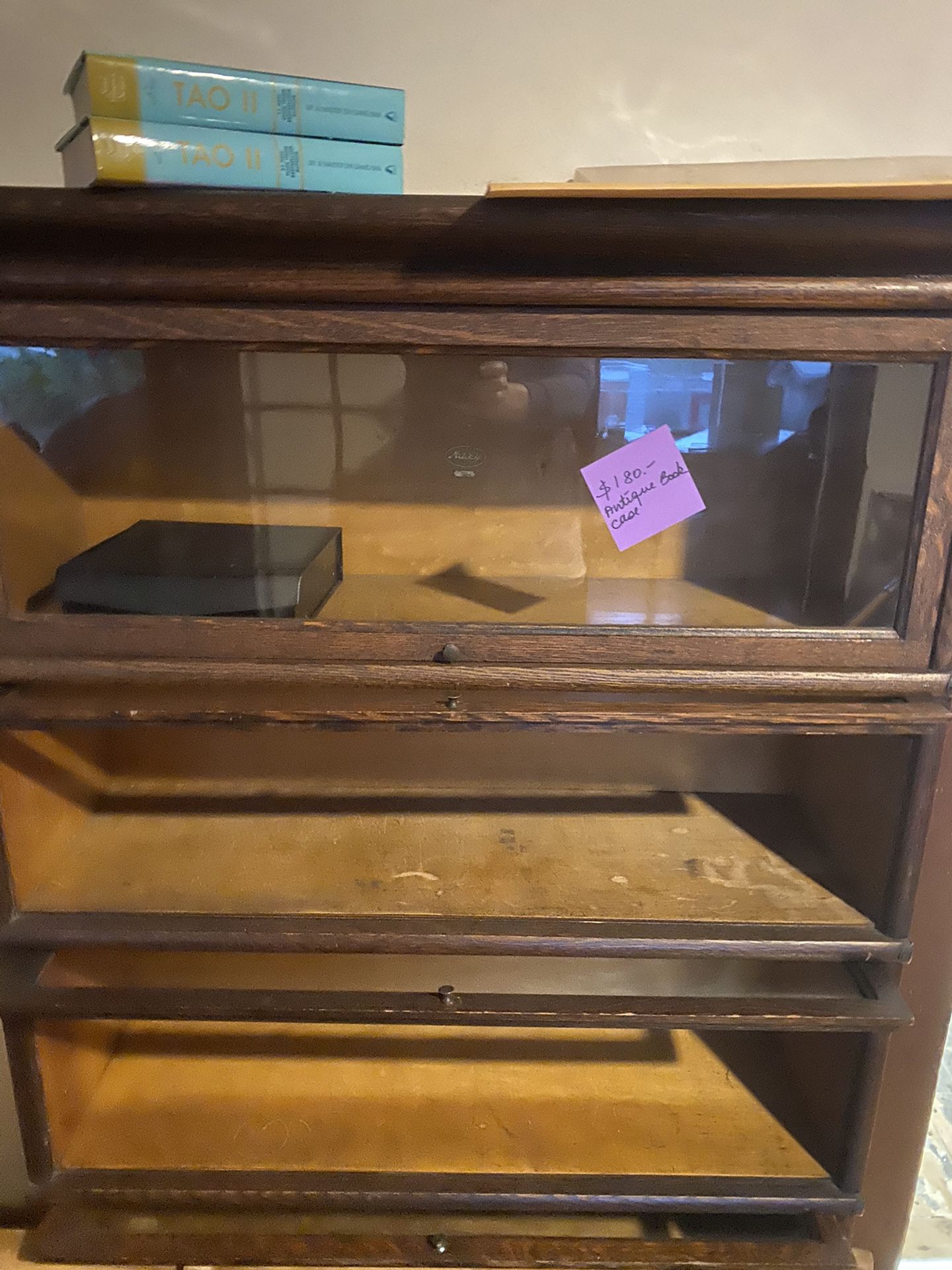 Antique cabinet with glass drop down shelf covers