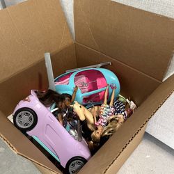 Box full of Barbie toys