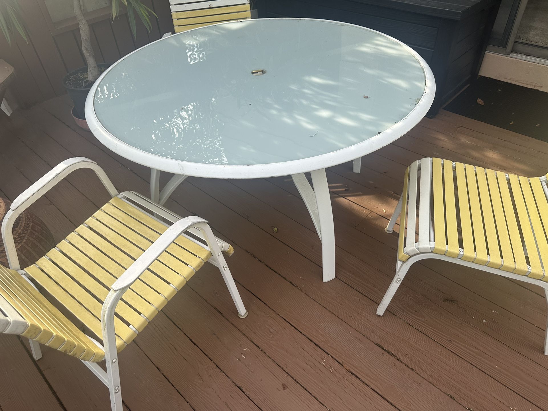 Outdoor set with 8 chairs and table 50” table approx. - 1 is longer chair and one is rocker