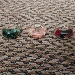 RESIN FLOWER RINGS. SIZE 6.5  NEW.  $5 EACH.  PICKUP ONLY.