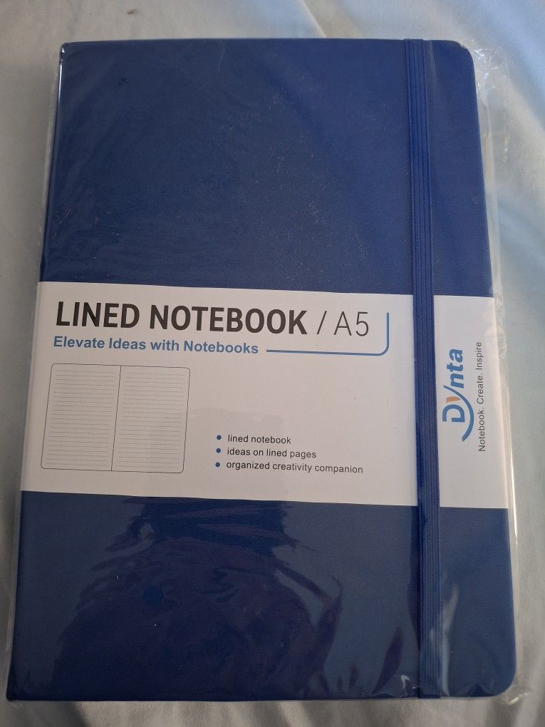 Elevate your ideas with this blue lined notebook by Dynta. Perfect for organized creativity.