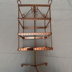 copper-toned metal rotating 4-tier earring display stand