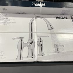 Kohler Oresund Pull-Down Bridge Kitchen Faucet with a two-function pull-down sprayhead and a soap/lotion dispenser