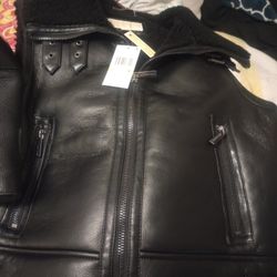 Black Michael Kors handbag and vest to match! 