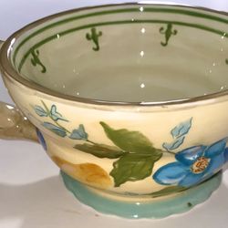 Hand-painted coffee mug by Tracy Porter. featuring yellow & blue floral prints