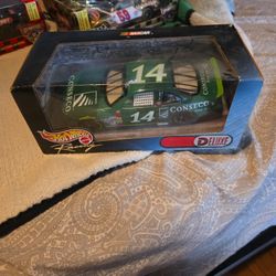 Hot Wheels Race Day Deluxe #14 Die-Cast Car. This 1:24 scale NASCAR car comes unused in the original box.