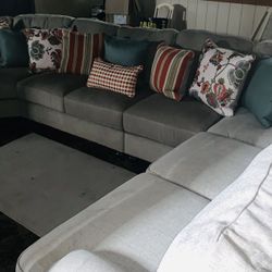 Tan 3 Piece Sectional  With Wooden Legs 