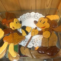 Handcrafted Disney intarsia wood carving featuring several characters, including Mickey Mouse, Lion King , Chip, and Dale