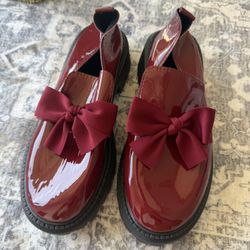 Glossy red loafers
