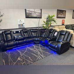 Black leather reclining sectional sofa with led light