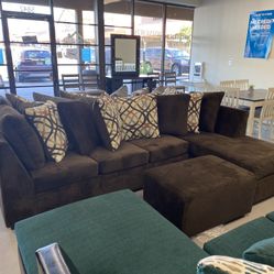 Brown Sectional With Designed Pillows 