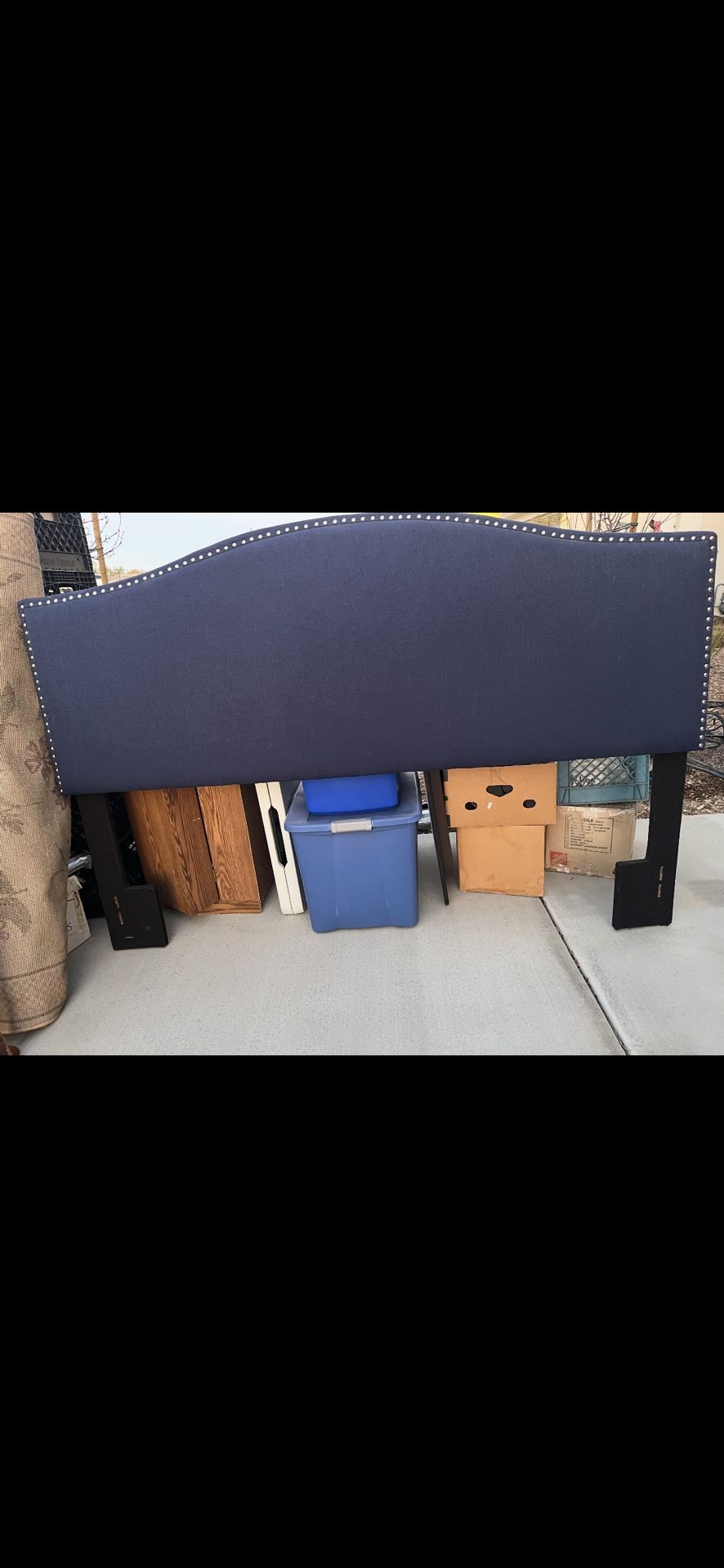 Blue material nail head headboard