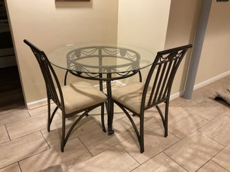Glass top dining room table with 4 chairs