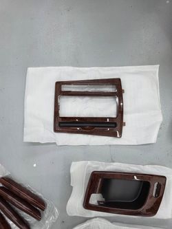 2003 to 2007 Cadillac CTS wood grain original radio cover. NEW