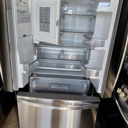 Kenmore brand 3-door refrigerator, 36 inches wide, 68.5 inches high, and 24 inches deep.