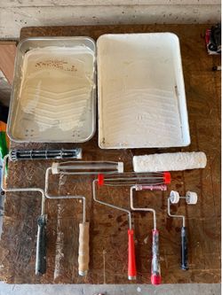 Assorted paint rollers and pans