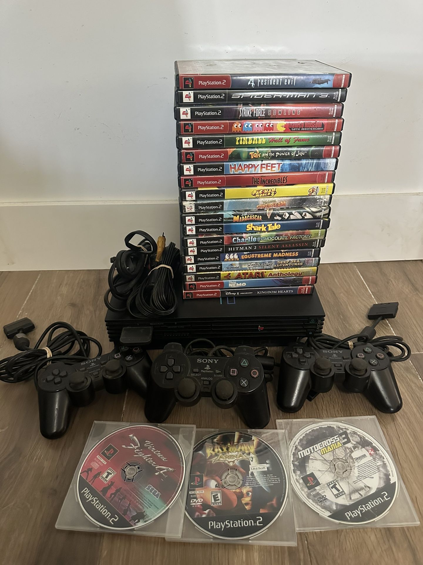 PlayStation 2 with 22 games and 3 controllers