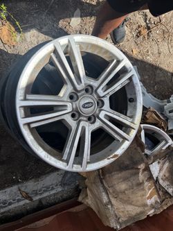 Four 17 inch ford mustang rims like new