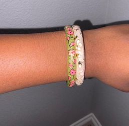 Green and white floral decorated bangle bracelets