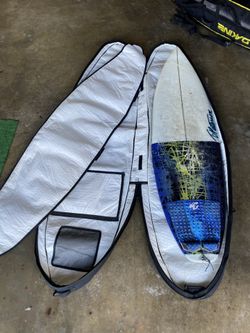 Surfboard And Travel Bag