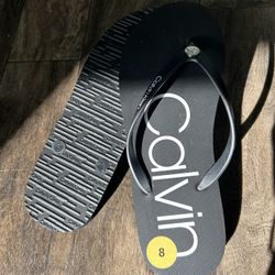 Brand New Calvin Klein Flip Flops – Size 8