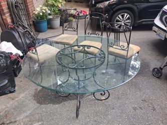 Wrought iron glass table with matching set of 4  chairs