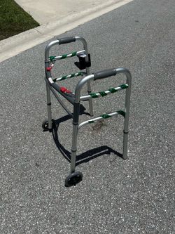 Deluxe folding aluminum walker with front wheels