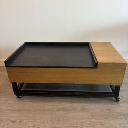 Coffee table with lift up storage