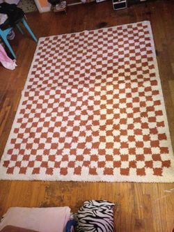 Burnt orange checkered rug