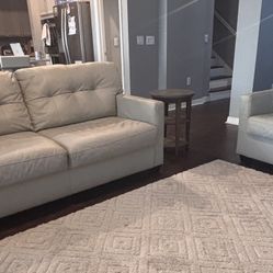 Cream Colored Sofa And Loveseat With End Tables