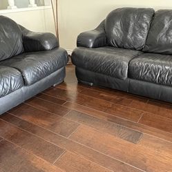 NATUZZI BLACK LEATHER COUCH SET - Love seat is 60” Sofa is 83”