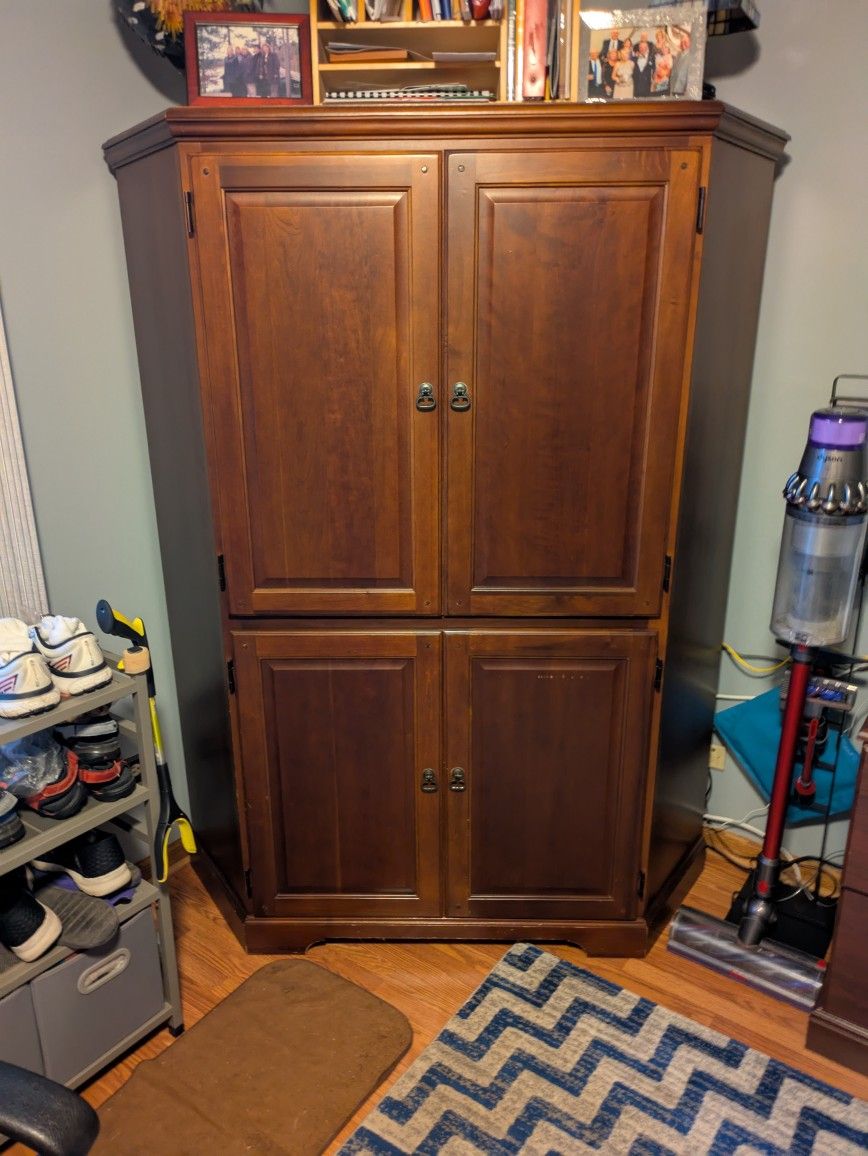 Computer Armoire With Lots Of Storage. You Can Close The Cabinet To Hide It All Away.