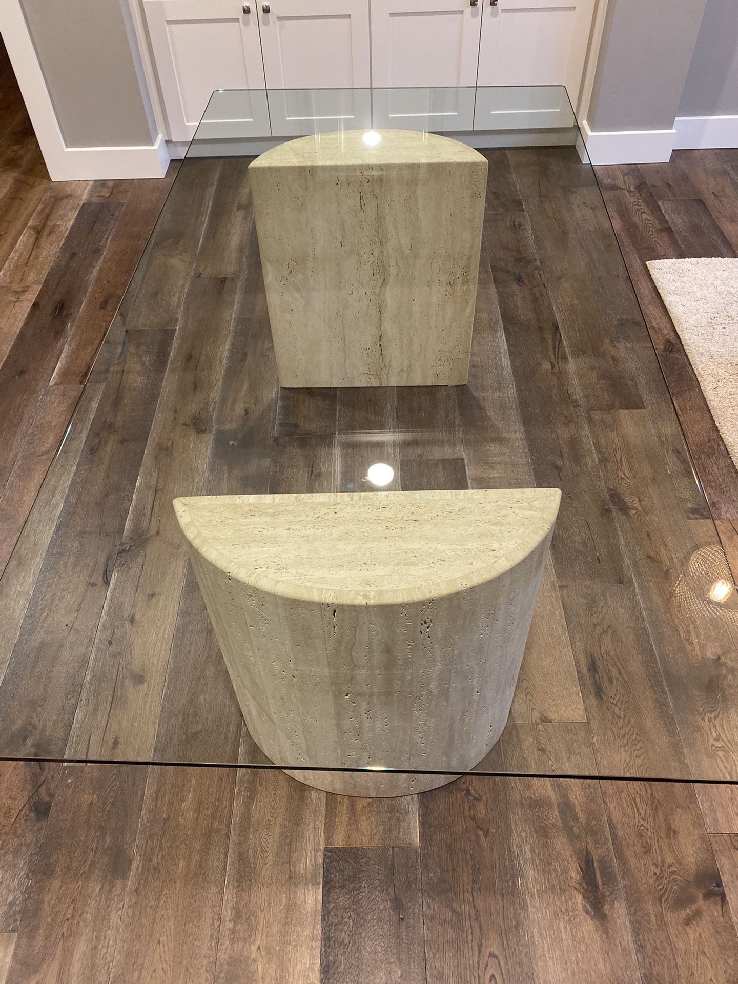 Glass table with travertine base 40x78”. H: 29”