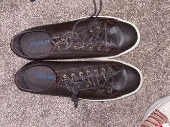 Brown leather converse