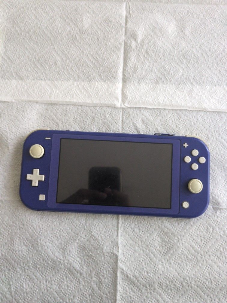 Nintendo Switch Lite, Blue, 2 Games Included.
