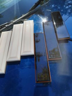 Fifth Avenue sky cloud and Zia molasses 2x8 Tile