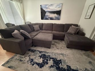 Lightly Used U-Shaped Sectional Sofa with Ottoman (Dark Gray/Blueish)