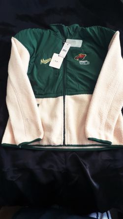 This is a WEAR by Erin Andrews Minnesota Wild green and white fleece jacket