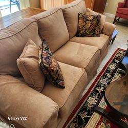 Large beautiful brown couch