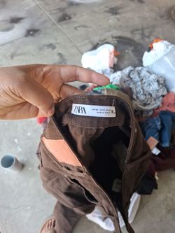 Multiple trash bags of womens clothes