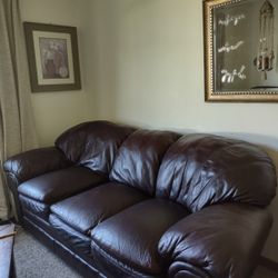 Leather couch, and loveseat with coffee table and end table